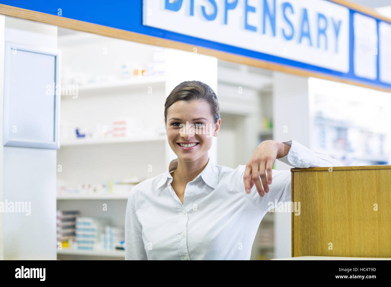 Young woman pharmacist standing hi-res stock photography and images - Alamy