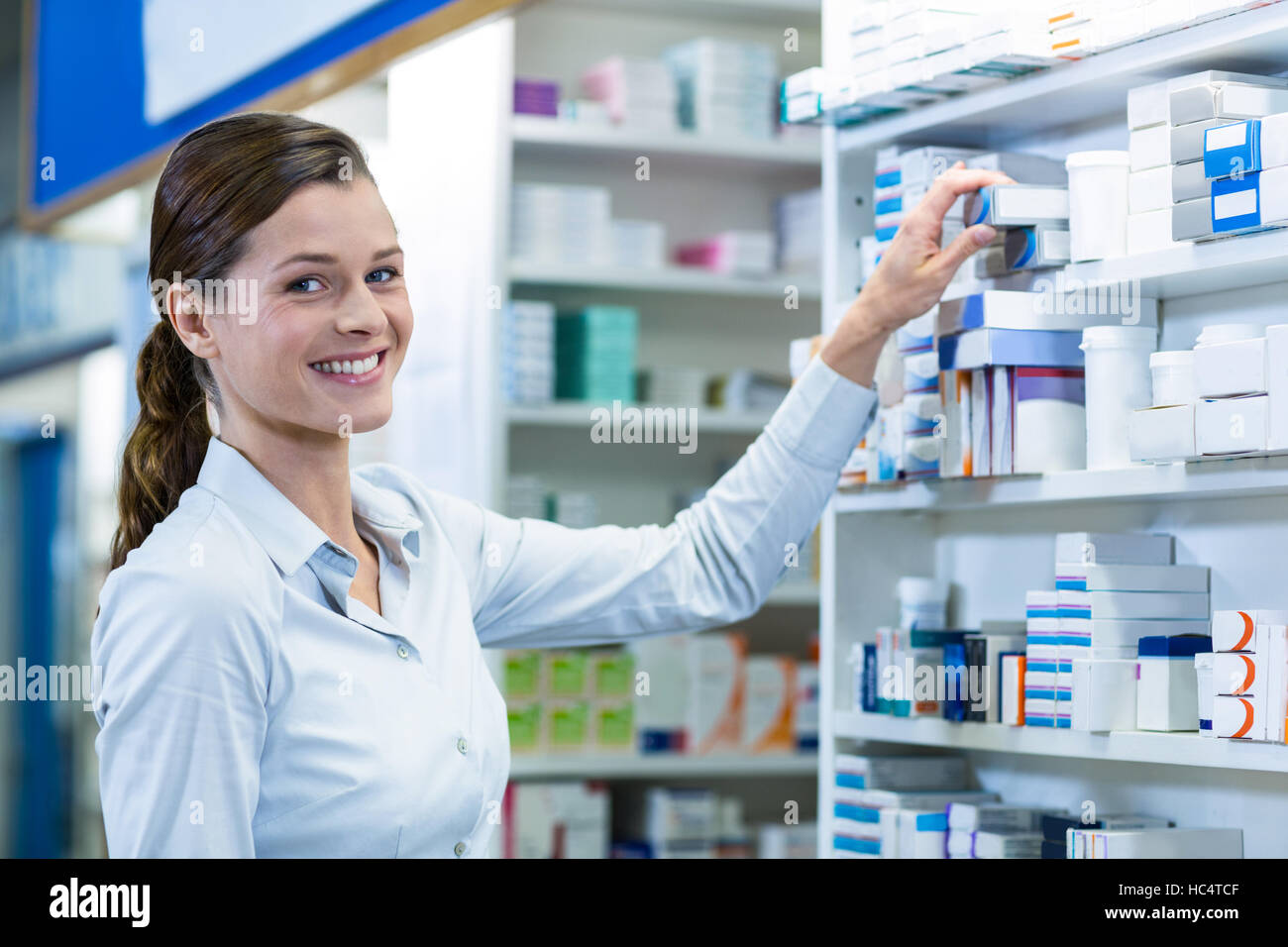 Beautiful young woman pharmacist hi-res stock photography and images ...