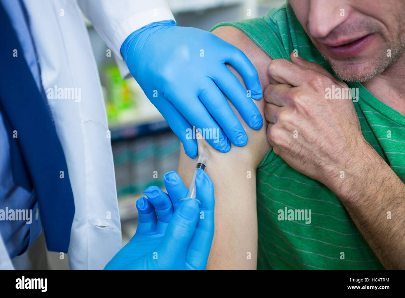 Help Injecting Pharmacist giving injection to patient Stock Photo - Alamy