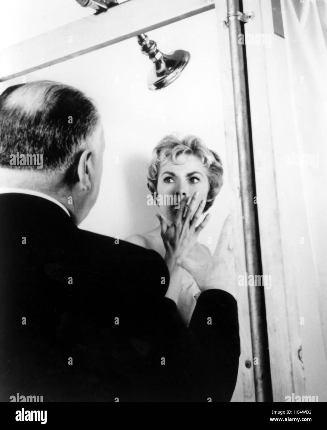 PSYCHO, Alfred Hitchock directs Leigh during shower scene, 1960