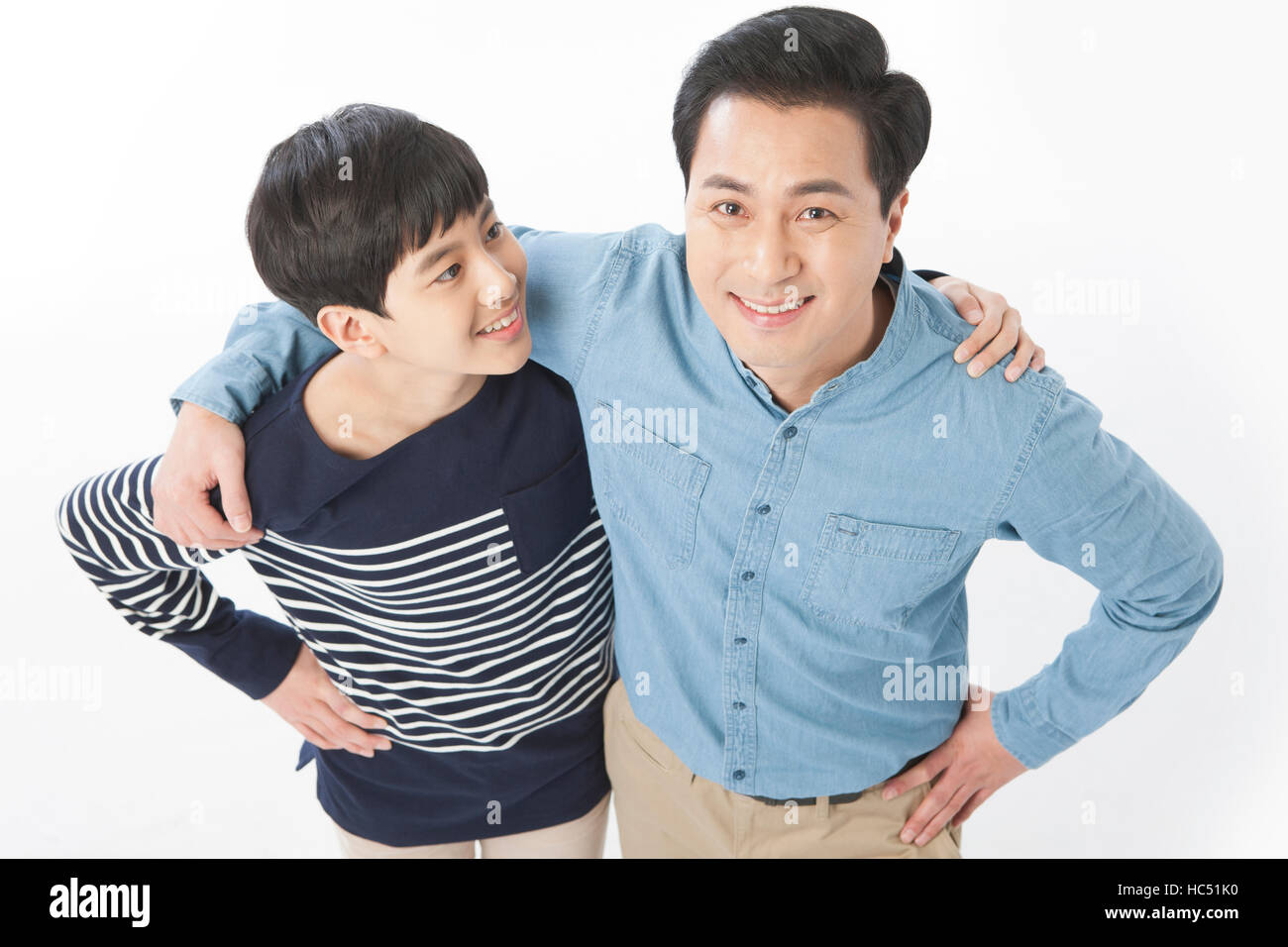 High angle view of loving father and son hugging looking up Stock Photo