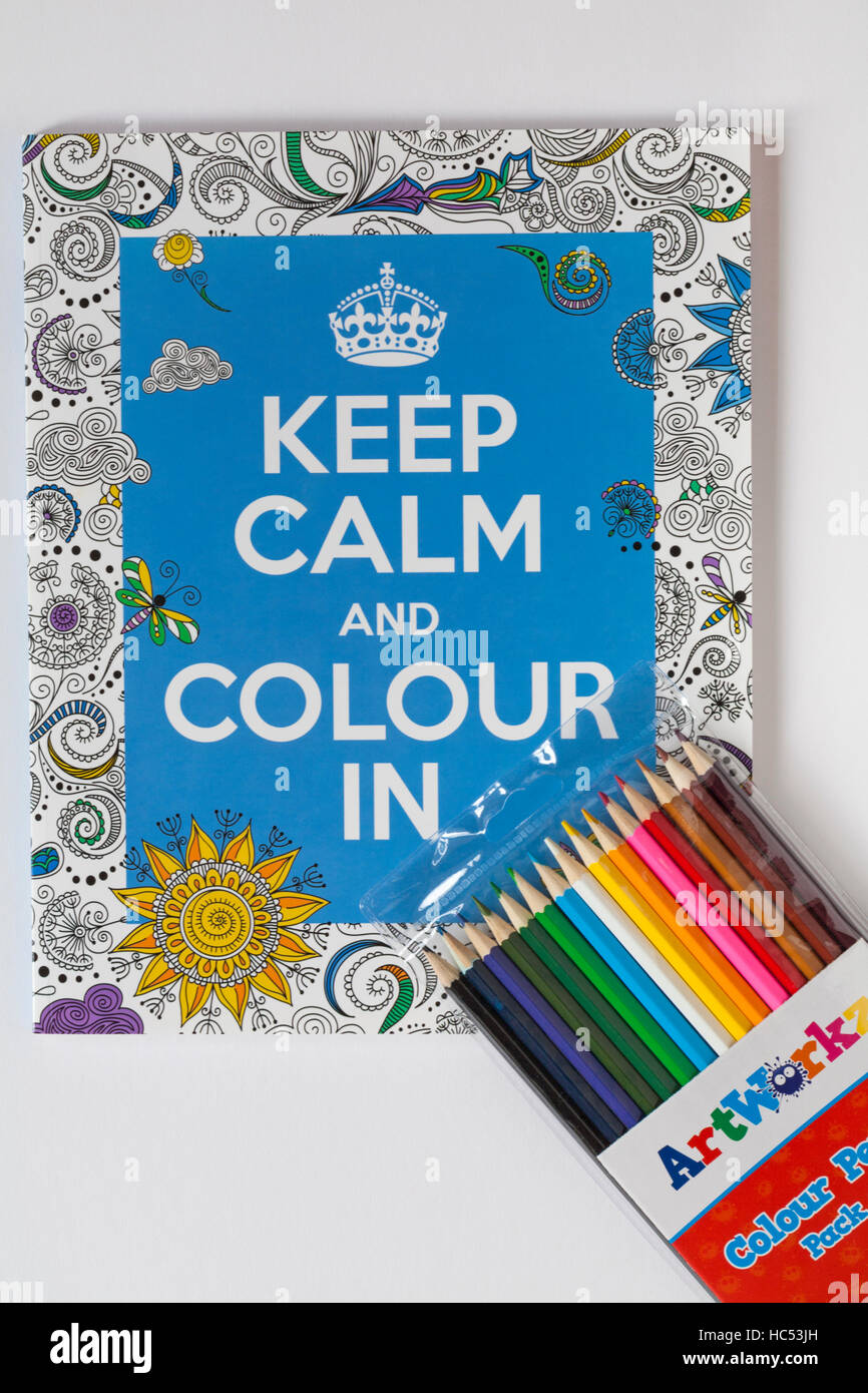 Keep Calm and Colour In colouring book to banish stress and worry, with pack of pencils set on white background Stock Photo