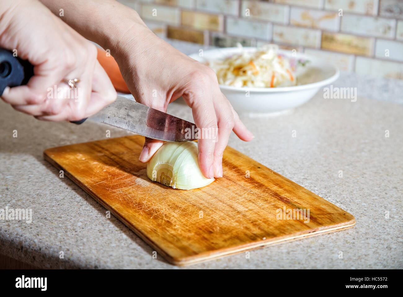Woman cuts cabbage on cutting hi-res stock photography and images - Alamy