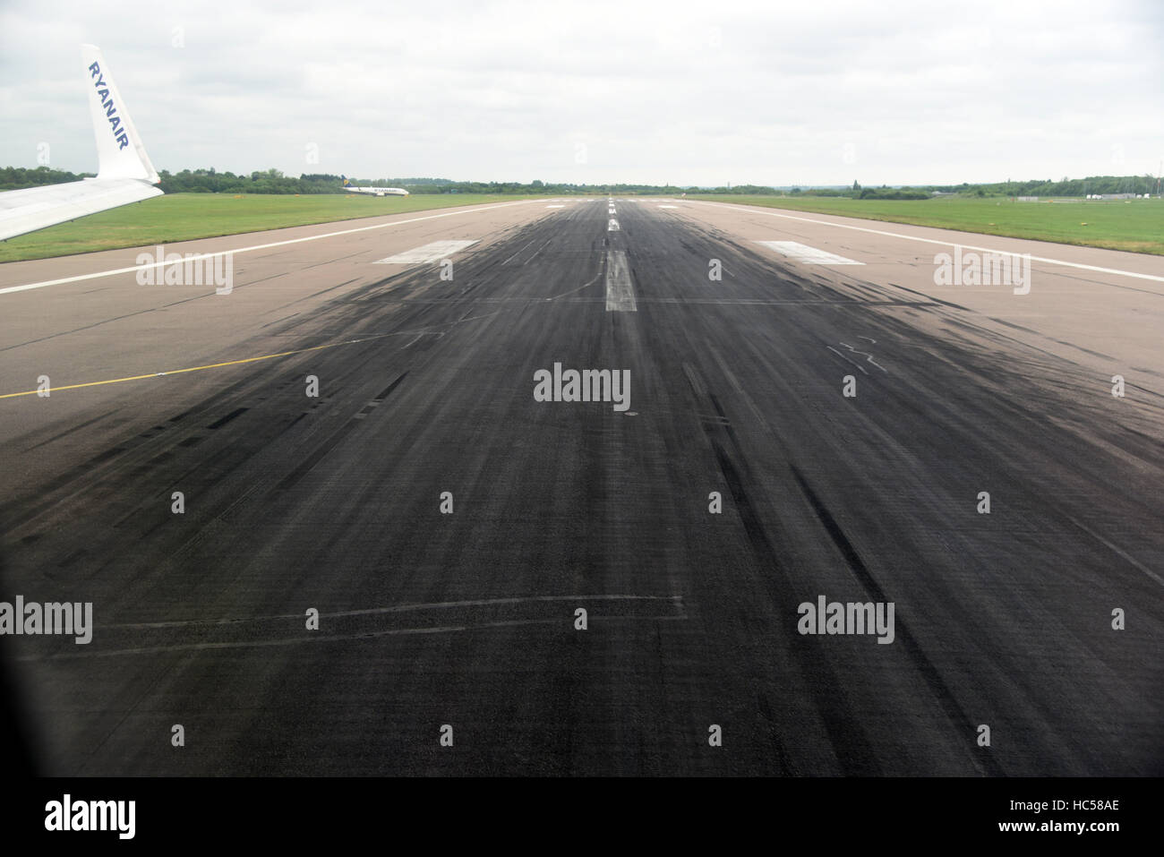 runway tarmac tyre marks skidmarks black landing Stock Photo