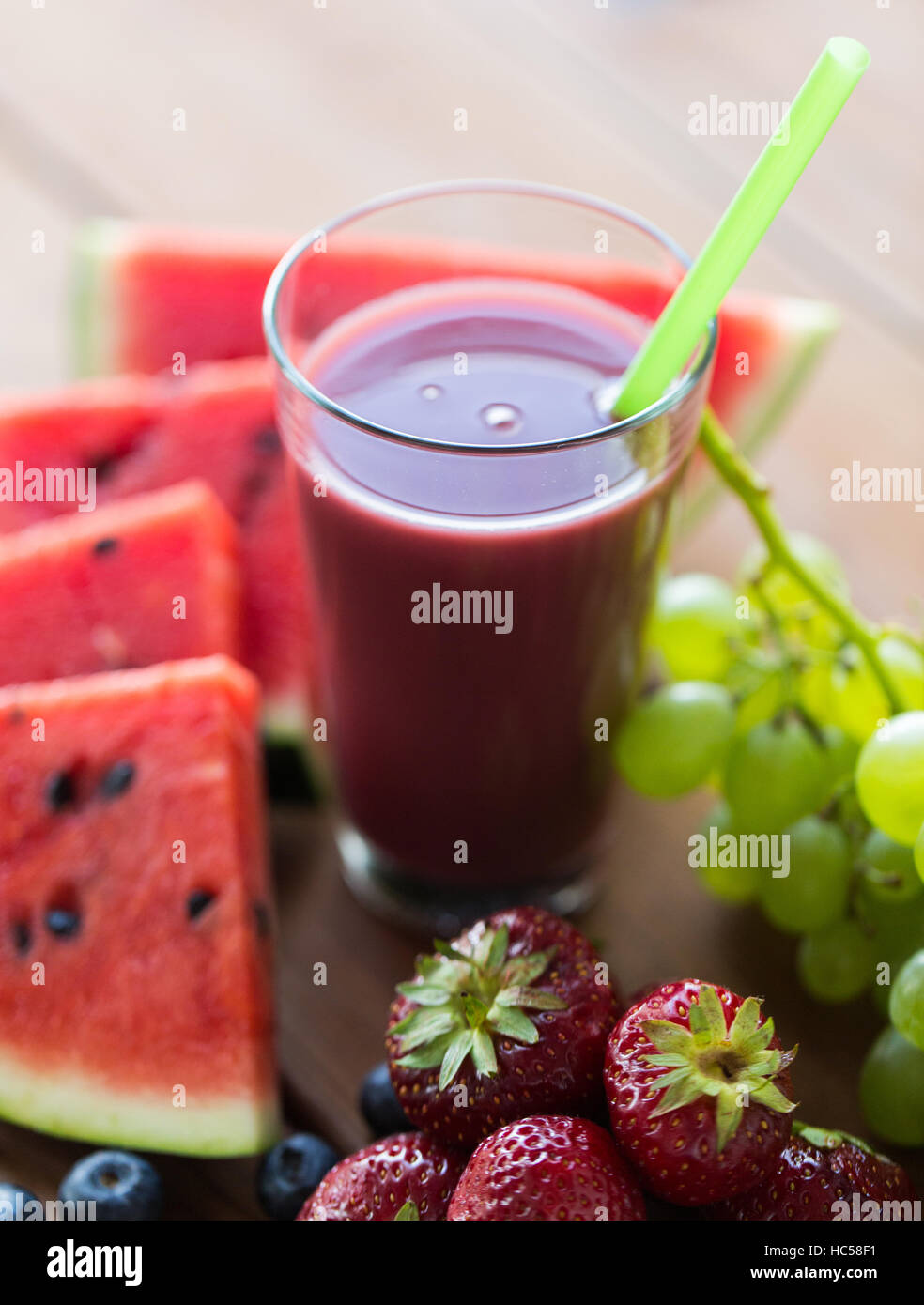 glass of fruit juice or smoothie with straw Stock Photo Alamy
