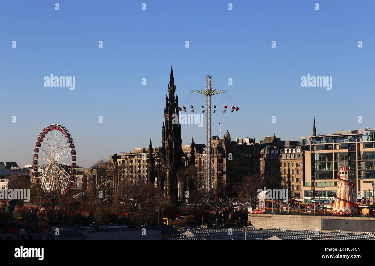 Ferris wheel, Scott Monument and Star Flyer ride Edinburgh Scotland December 2016 Stock Photo