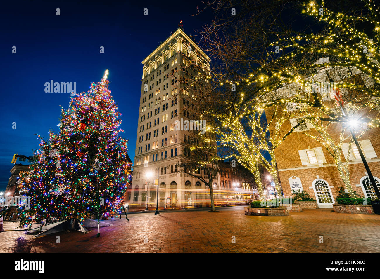 Christmas tree and buildings at Penn Square at night, in Lancaster