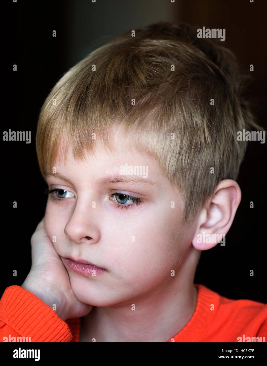 upset caucasian boy, soft focus Stock Photo