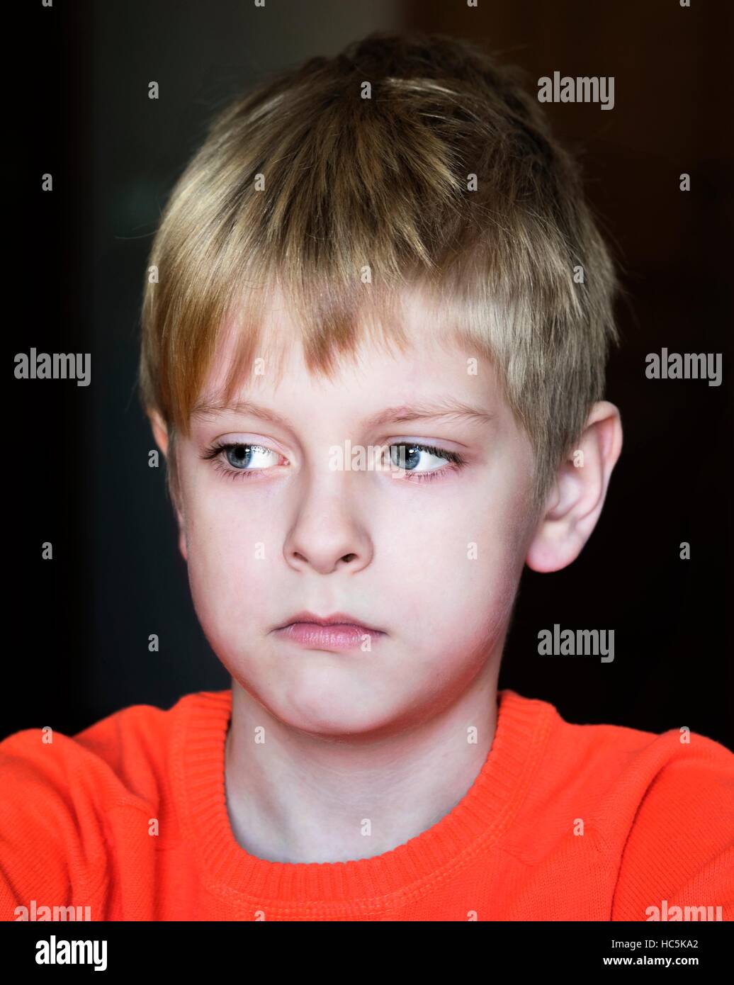 upset caucasian boy, soft focus Stock Photo