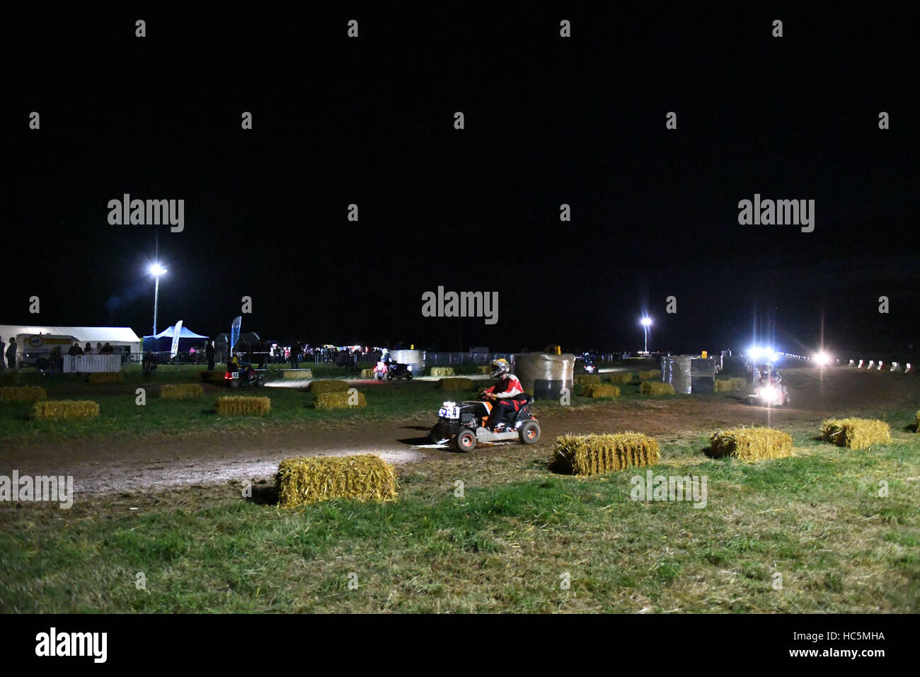The British Lawn Mower Racing Association 12 Hour lawn mower race in Five Oaks, near Billingshurst in West Sussex, UK.  The race started at 8pm going through the night non-stop until 8am with 63 teams taking part in the 12 hour endurance race.  Featuring: Stock Photo