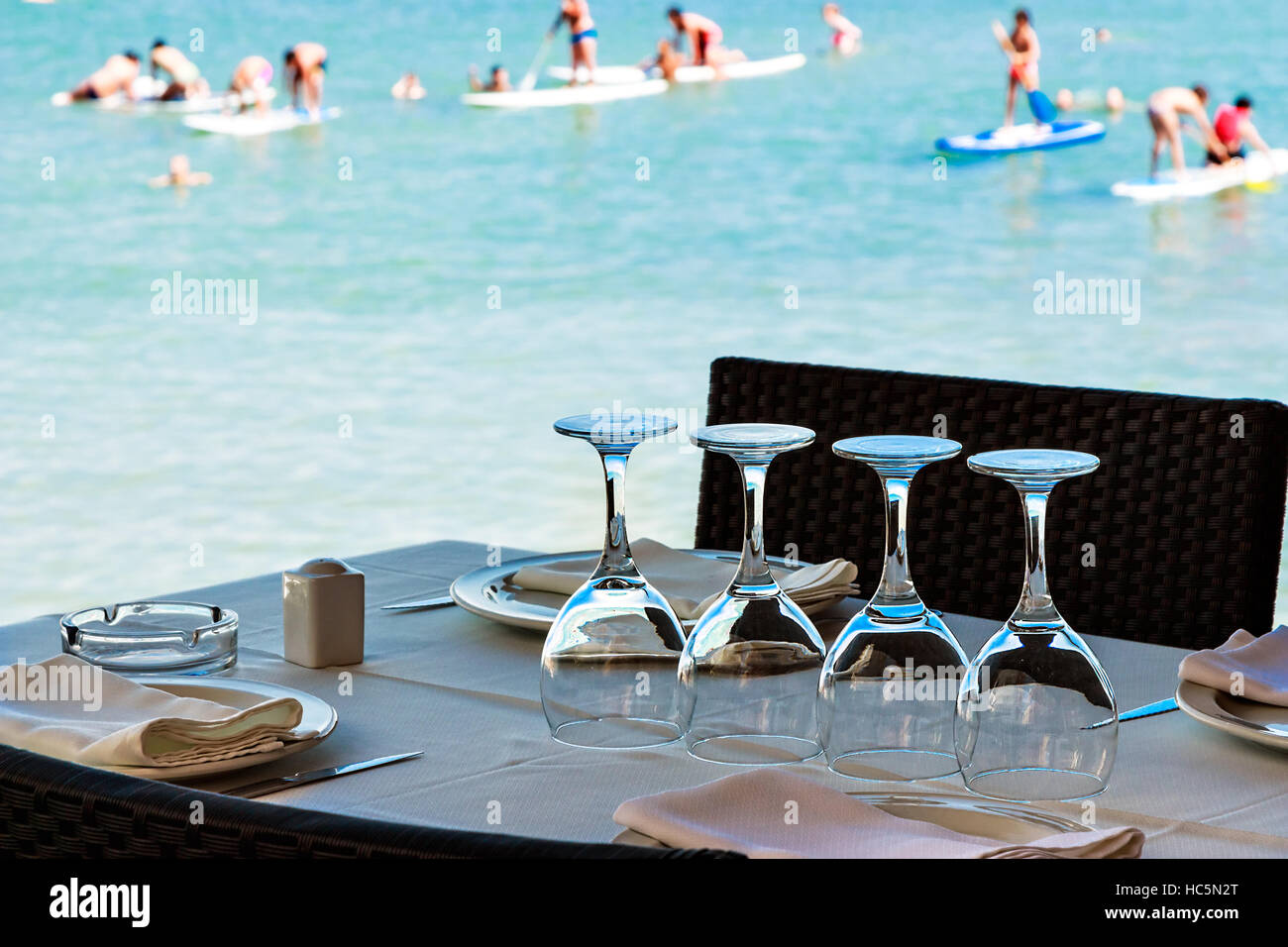 Restaurant on the seashore with the table set. Horizontal image Stock