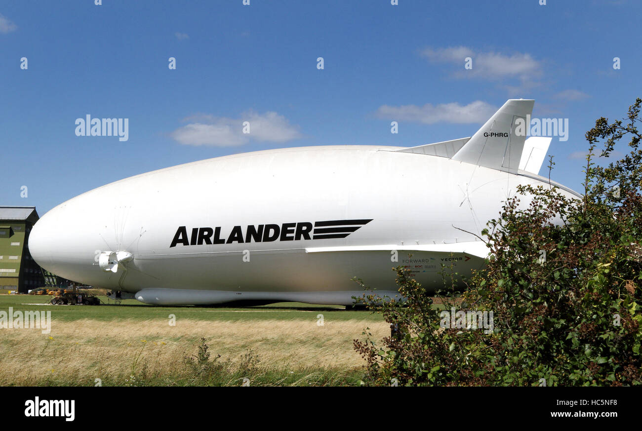 The world's largest aircraft was brought out of its hangar for the first time this weekend.   The plane/airship hybrid, Airlander 10, was moved out of the UK's biggest hangar at Cardington, Bedfordshire. The 302ft-long (92m) aircraft was towed to its mast Stock Photo
