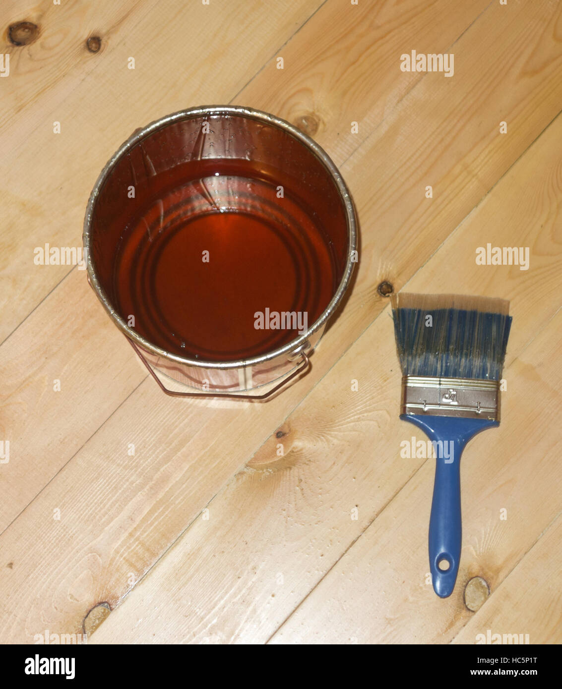 varnish brush with tin can on wooden floor Stock Photo Alamy