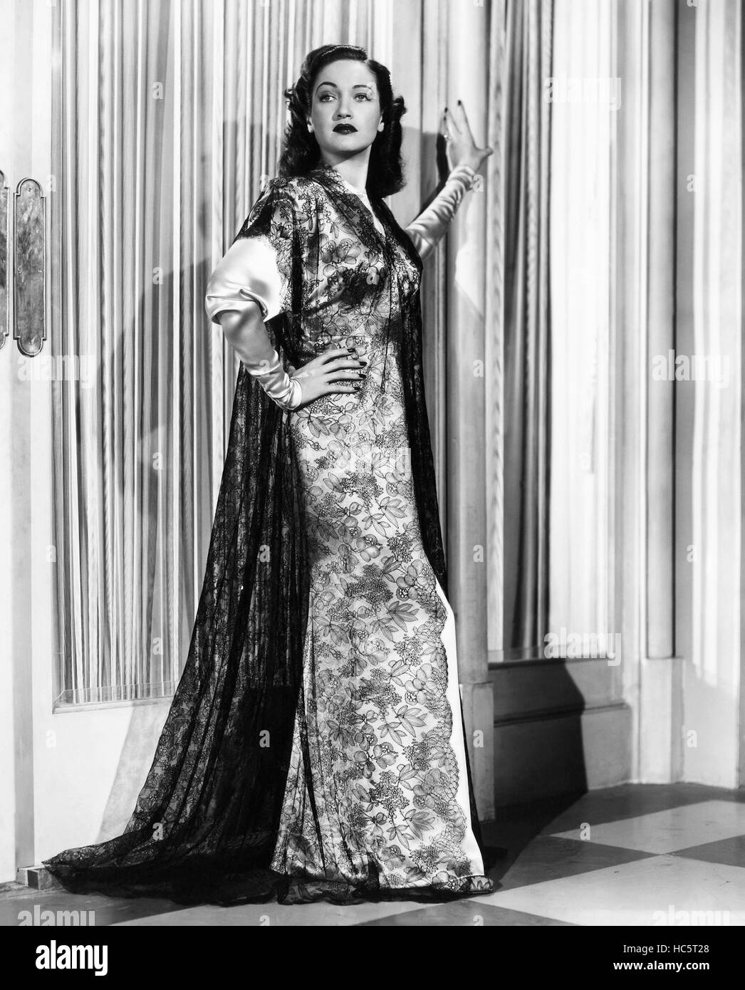 ROAD TO RIO, Dorothy Lamour, in a gold satin and black lace boudoir ensemble by Edith Head, 1947 Stock Photo