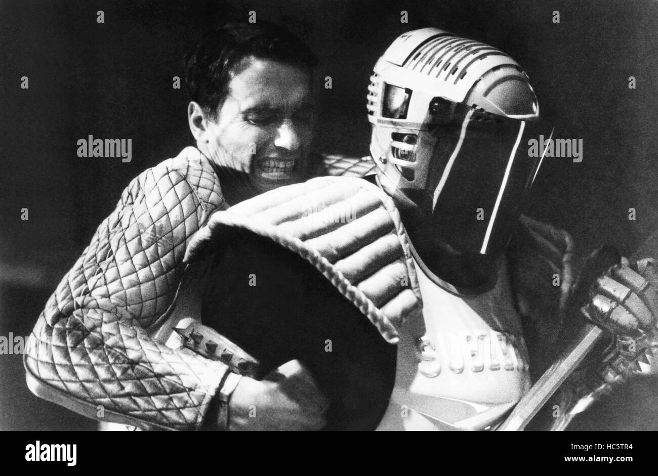 THE RUNNING MAN, from left, Arnold Schwarzenegger, Professor Toru