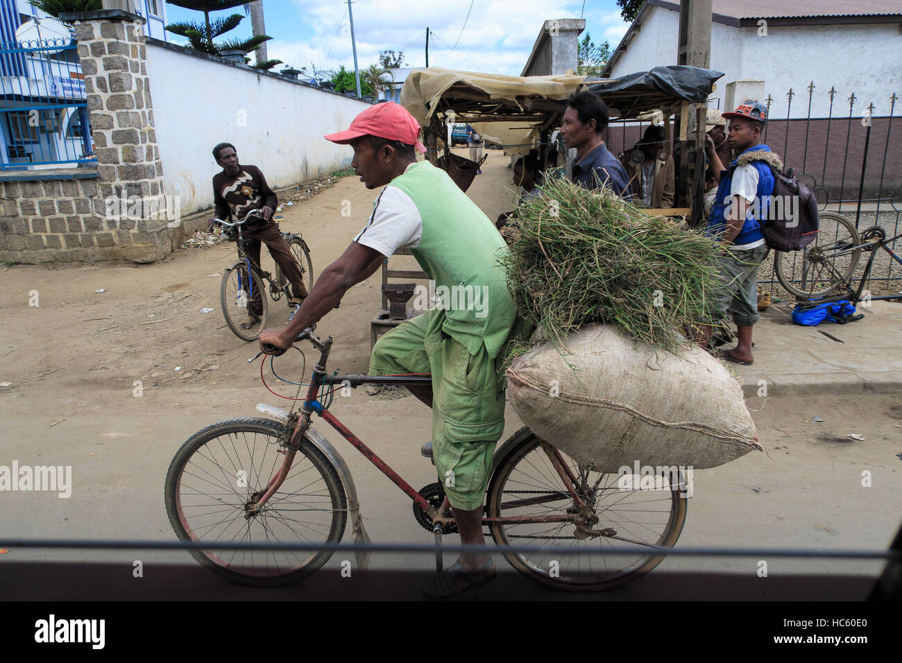Man on Loaded Cycle, Madagascar Stock Photo