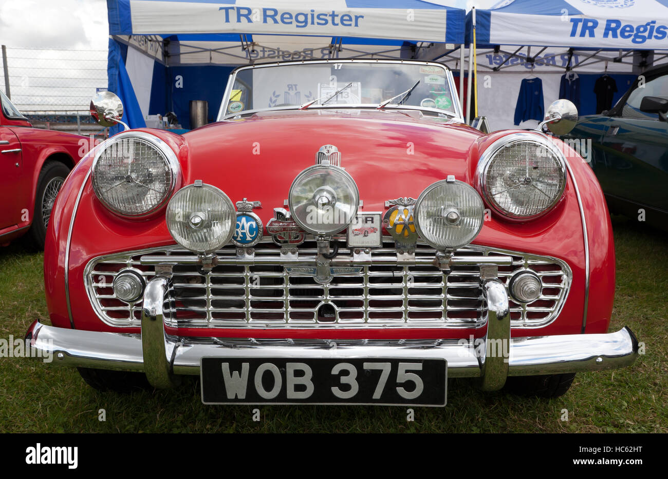 Front view of a red, 1958, Triumph TR3 Sports Car, in the TR Register Club zone of the Silverstone Classic 2016 Stock Photo