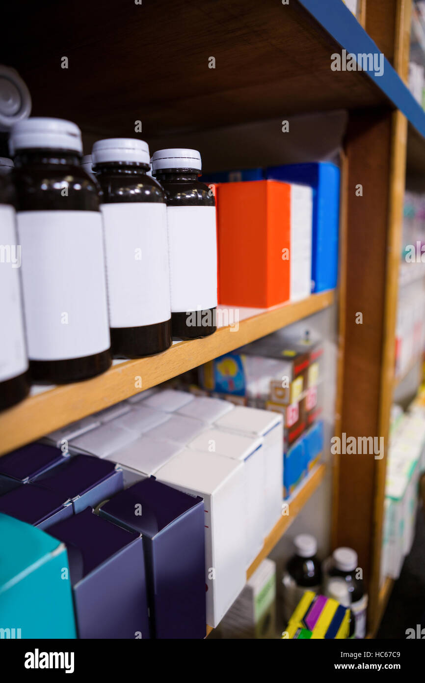 Various boxes and bottles of medicine on shelf Stock Photo - Alamy