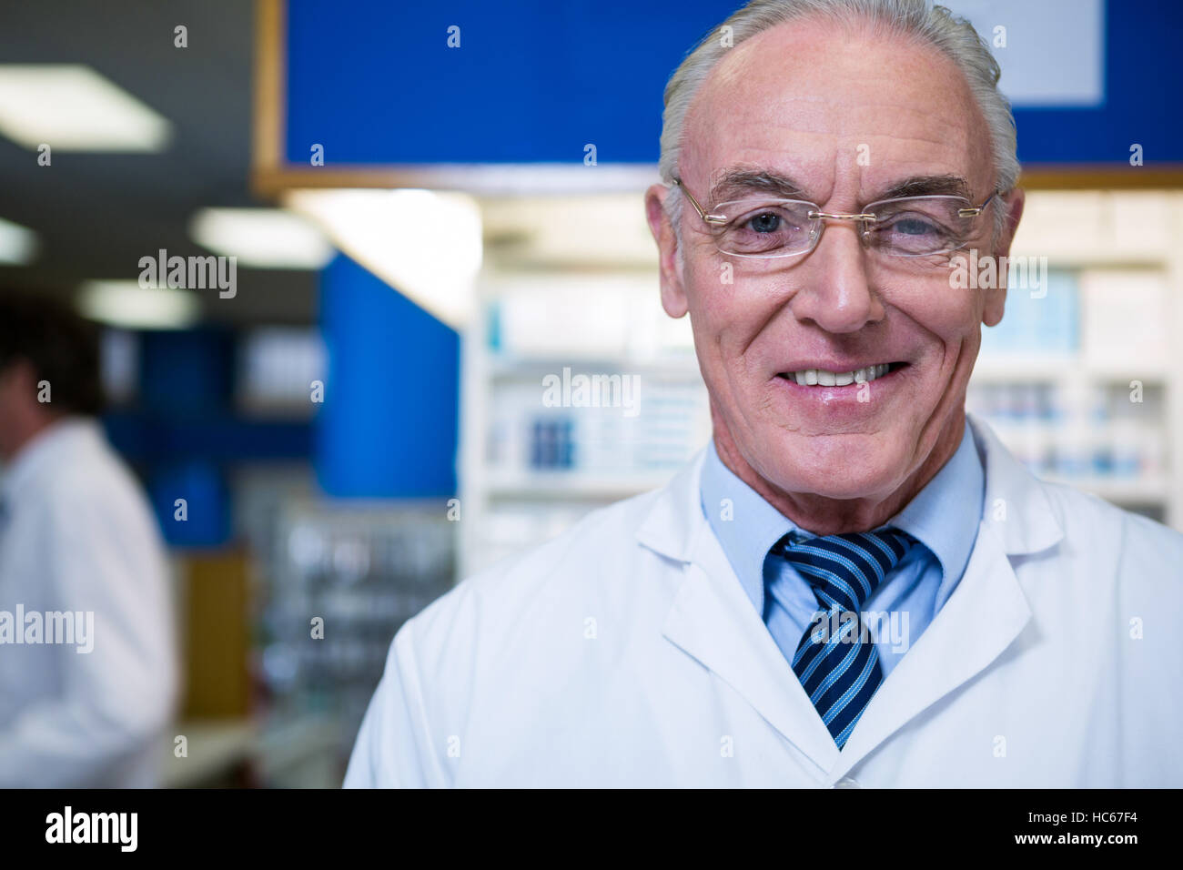 Pharmacist in lab coat Stock Photo - Alamy