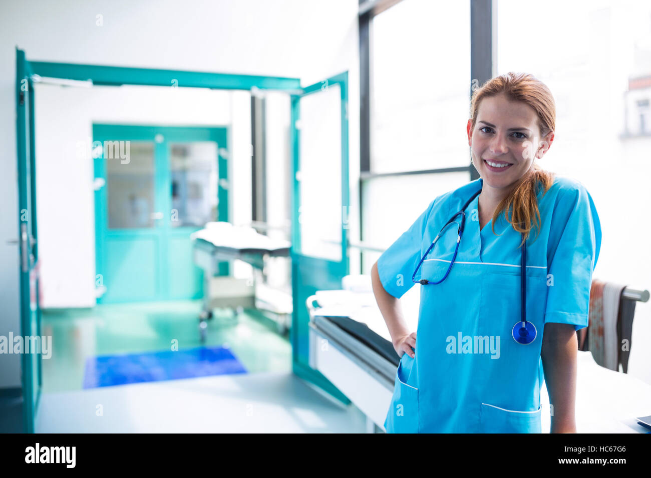 Portrait of surgeon standing in surgical room Stock Photo - Alamy