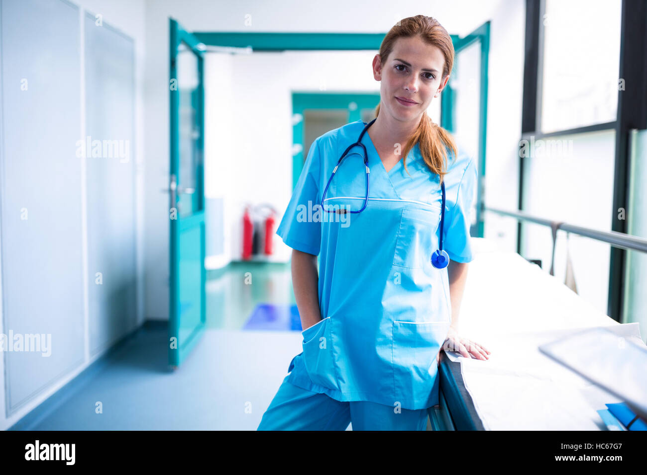 Portrait of surgeon standing in surgical room Stock Photo - Alamy