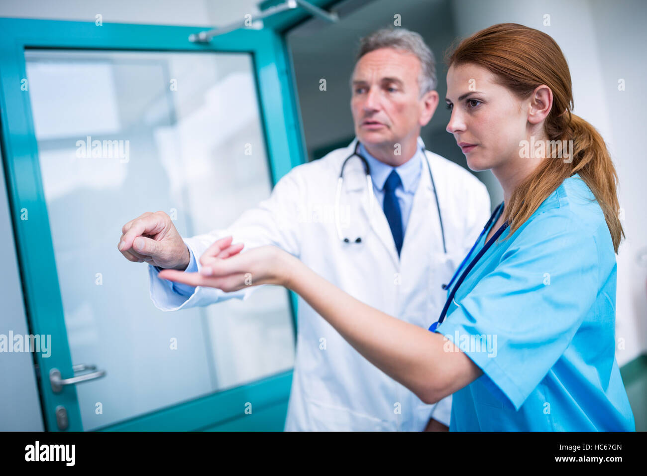 Doctor and surgeon discussing with each other Stock Photo