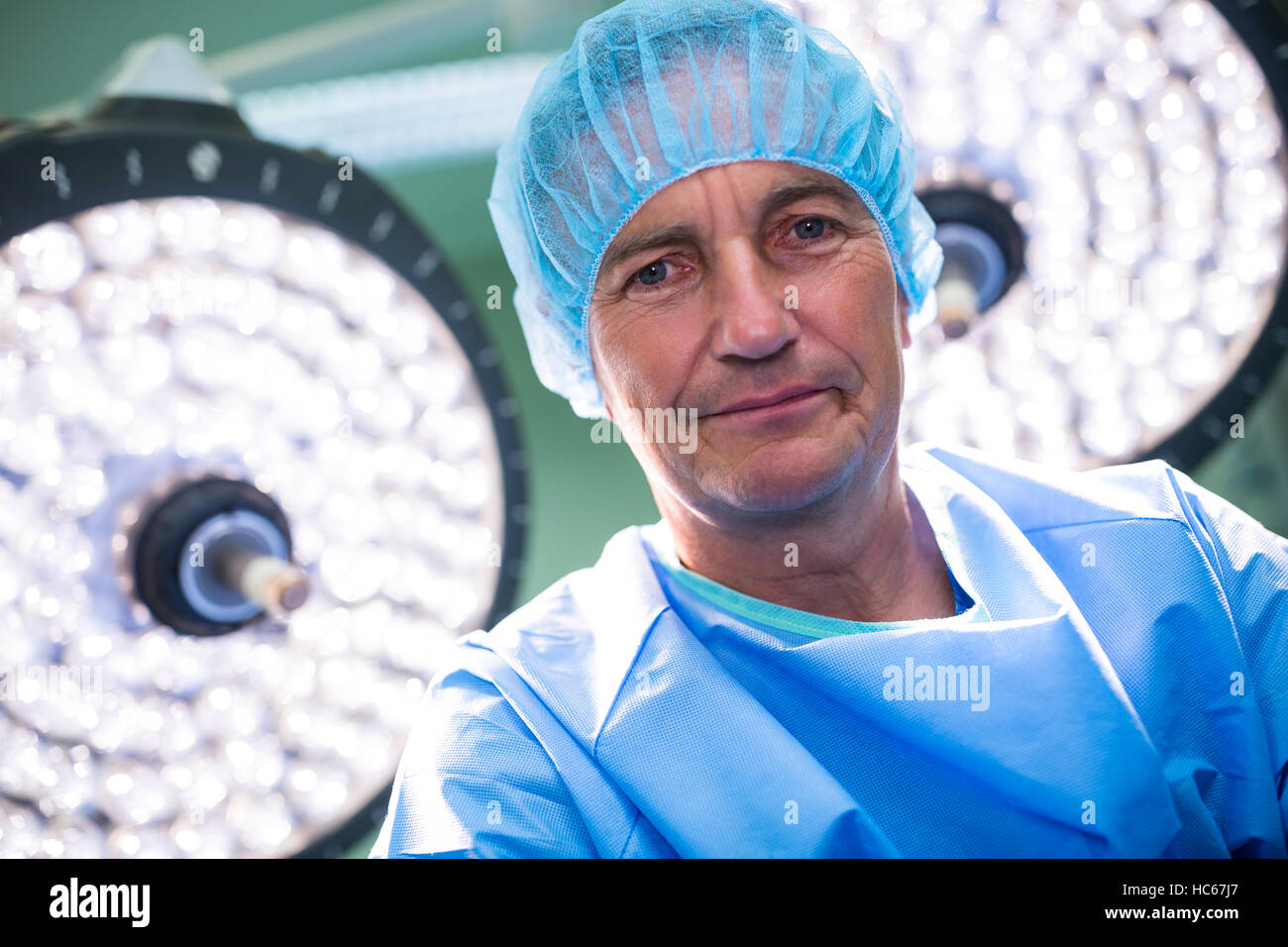 Portrait of surgeon standing in operation room Stock Photo - Alamy