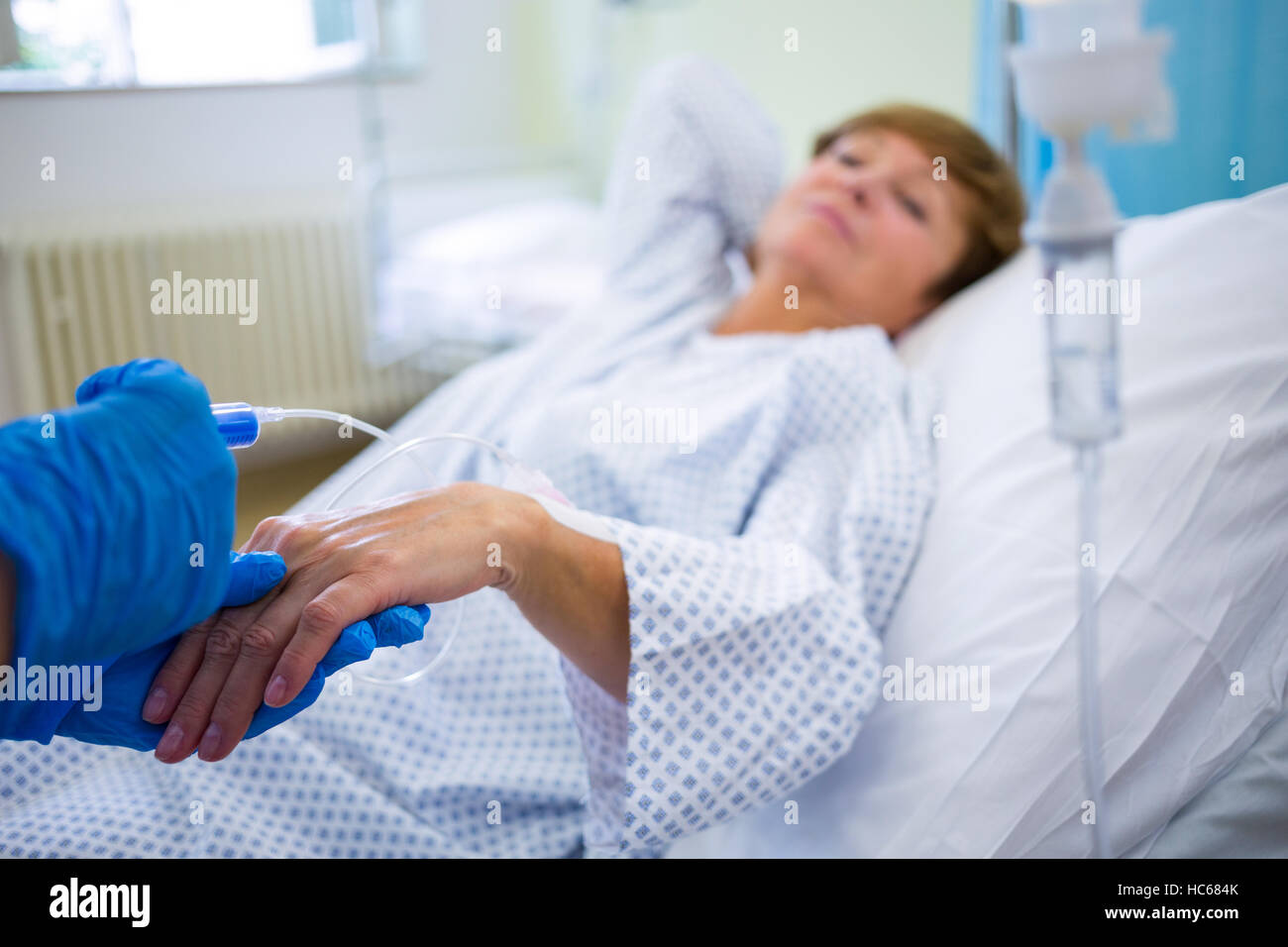 Nurse giving an injection to a patient Stock Photo Alamy
