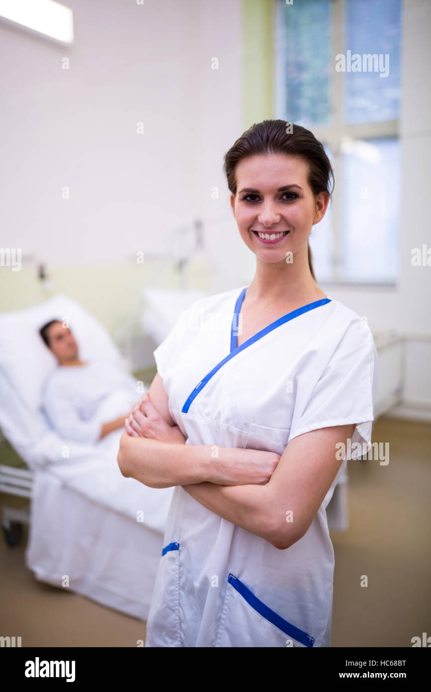 Female nurse standing in ward Stock Photo Alamy