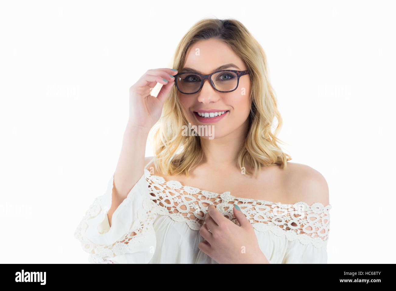 Portrait of beautiful woman posing with spectacles against white background Stock Photo