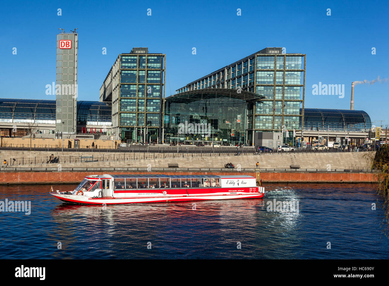 Boat on the Spree River in front of Berlin Hauptbahnhof main railway station, Berlin, Germany Stock Photo