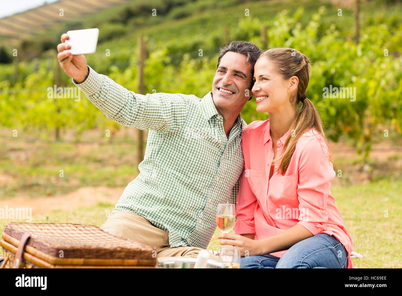 Happy couple taking a selfie Stock Photo - Alamy