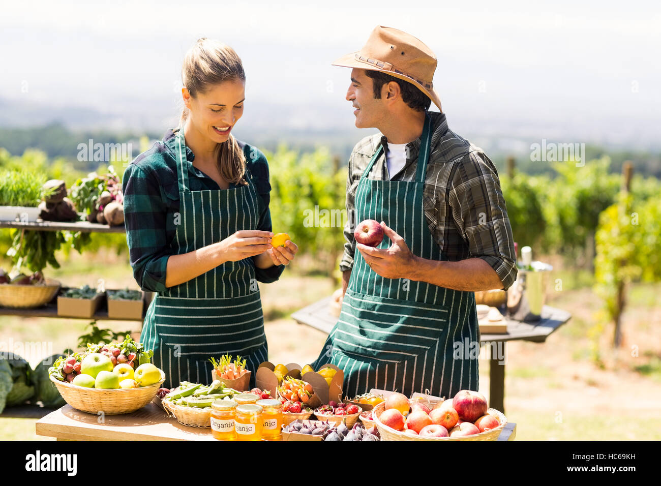 Farmer couple discussing with each other Stock Photo