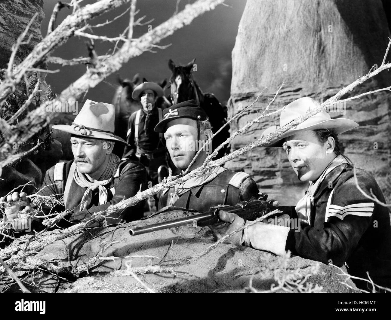 SHE WORE A YELLOW RIBBON, from left, John Wayne, Harry Carey, Jr., Ben