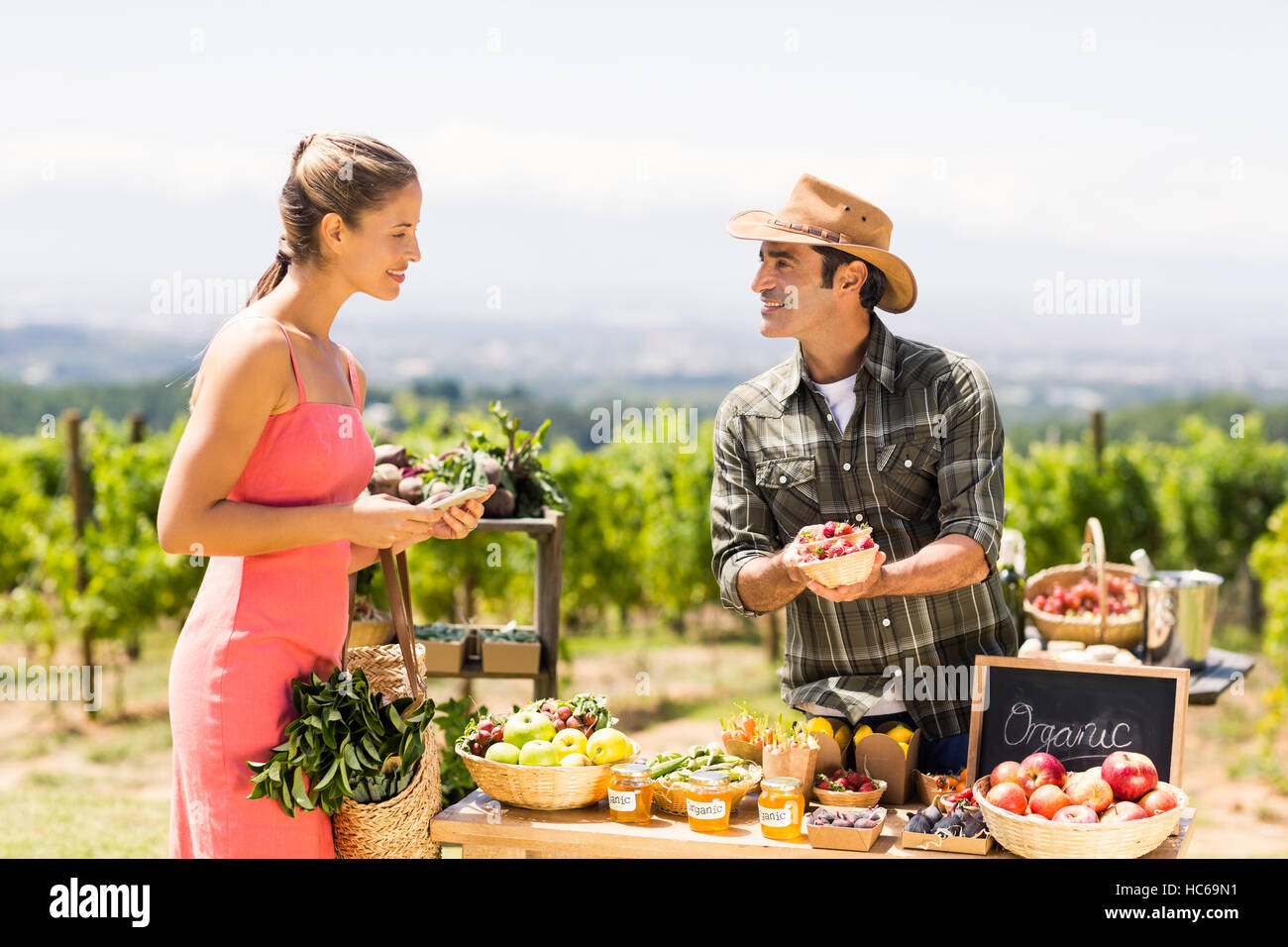 Farmer selling his organic produce to customer Stock Photo