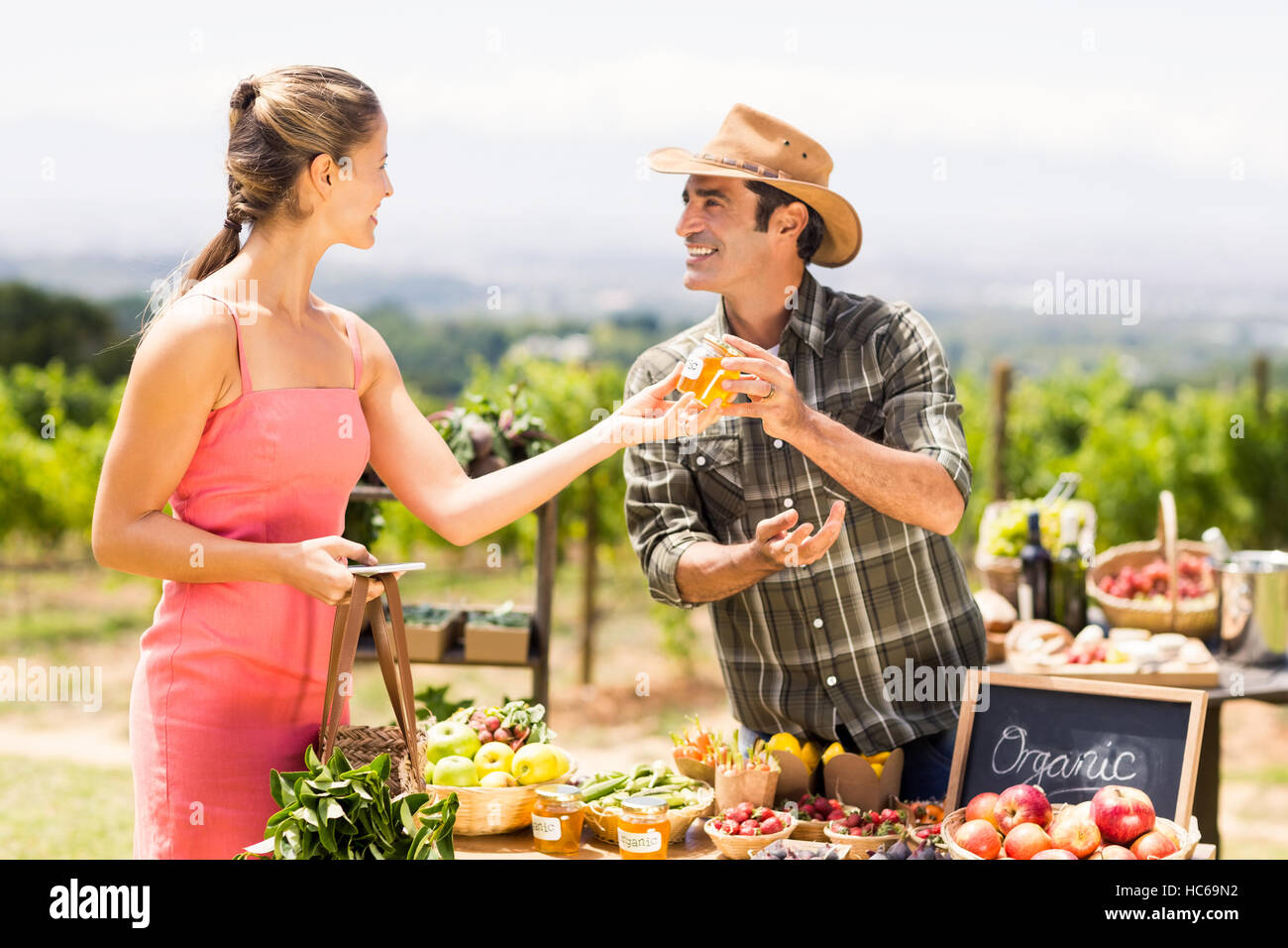 Farmer selling his organic produce to customer Stock Photo