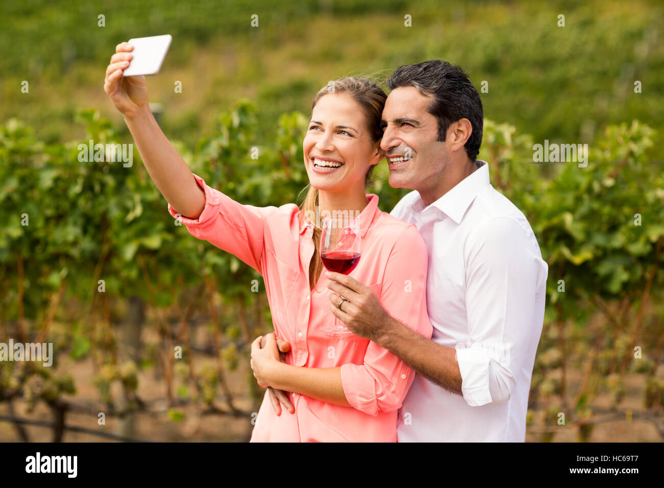 Happy couple taking a selfie Stock Photo - Alamy