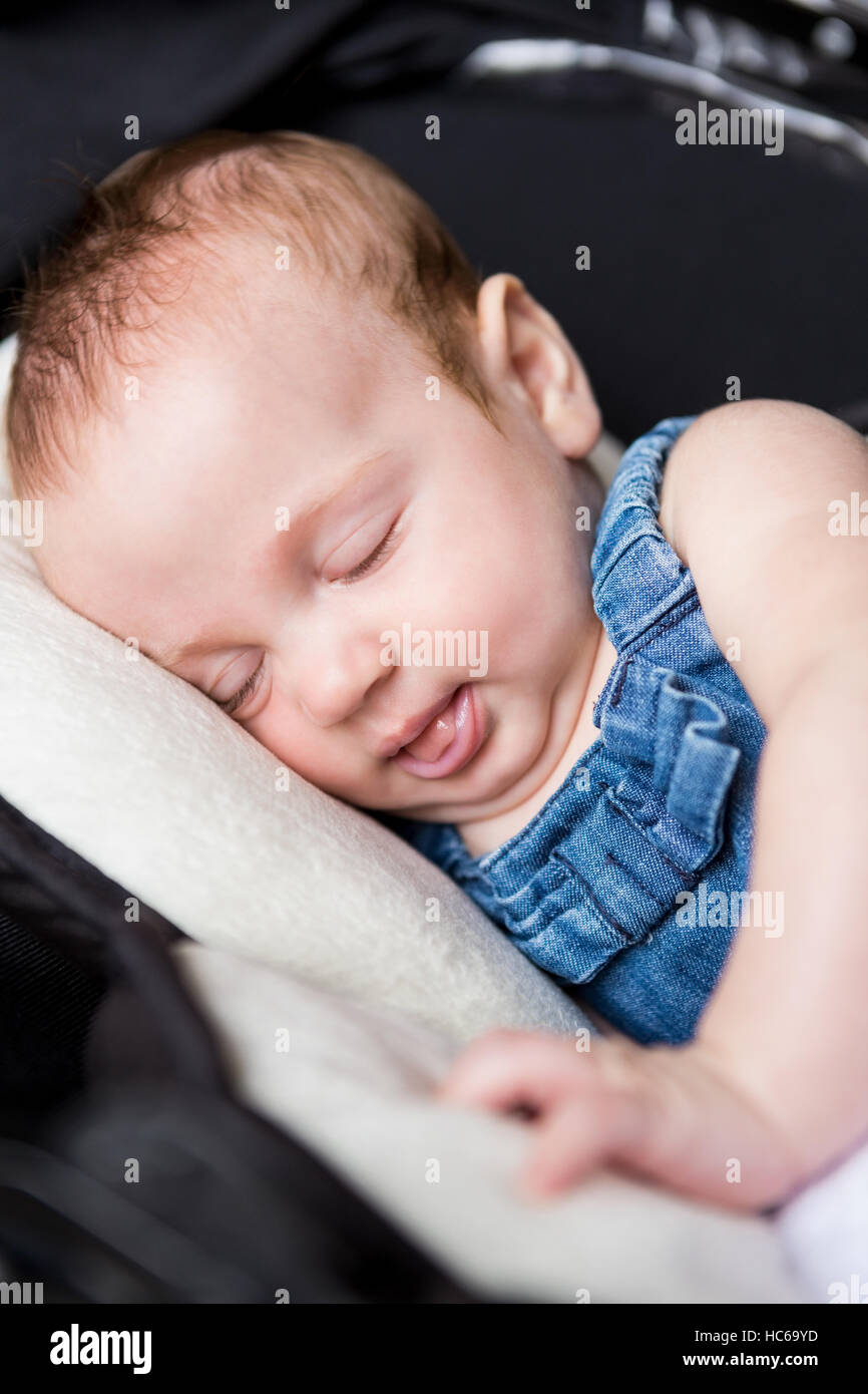 Baby sleeping in stroller Stock Photo