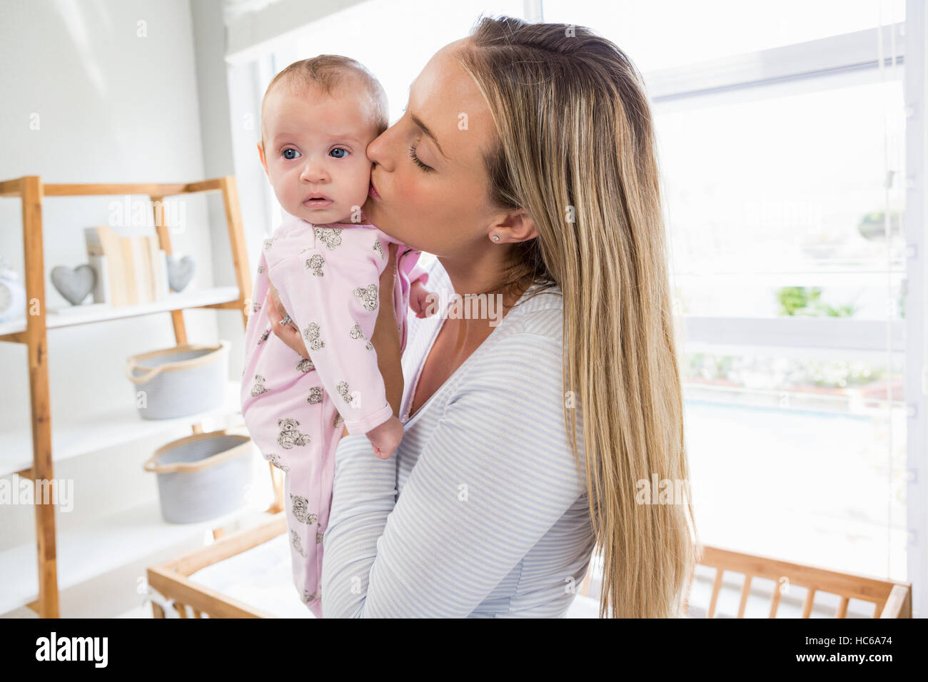 Mother holding her baby boy Stock Photo