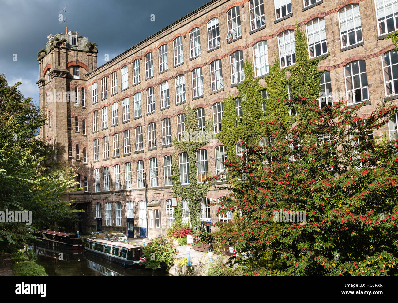 Clarence MIll in Bollington Cheshire.  The old textile mill is next to the Macclesfield Canal and is now used for office space Stock Photo