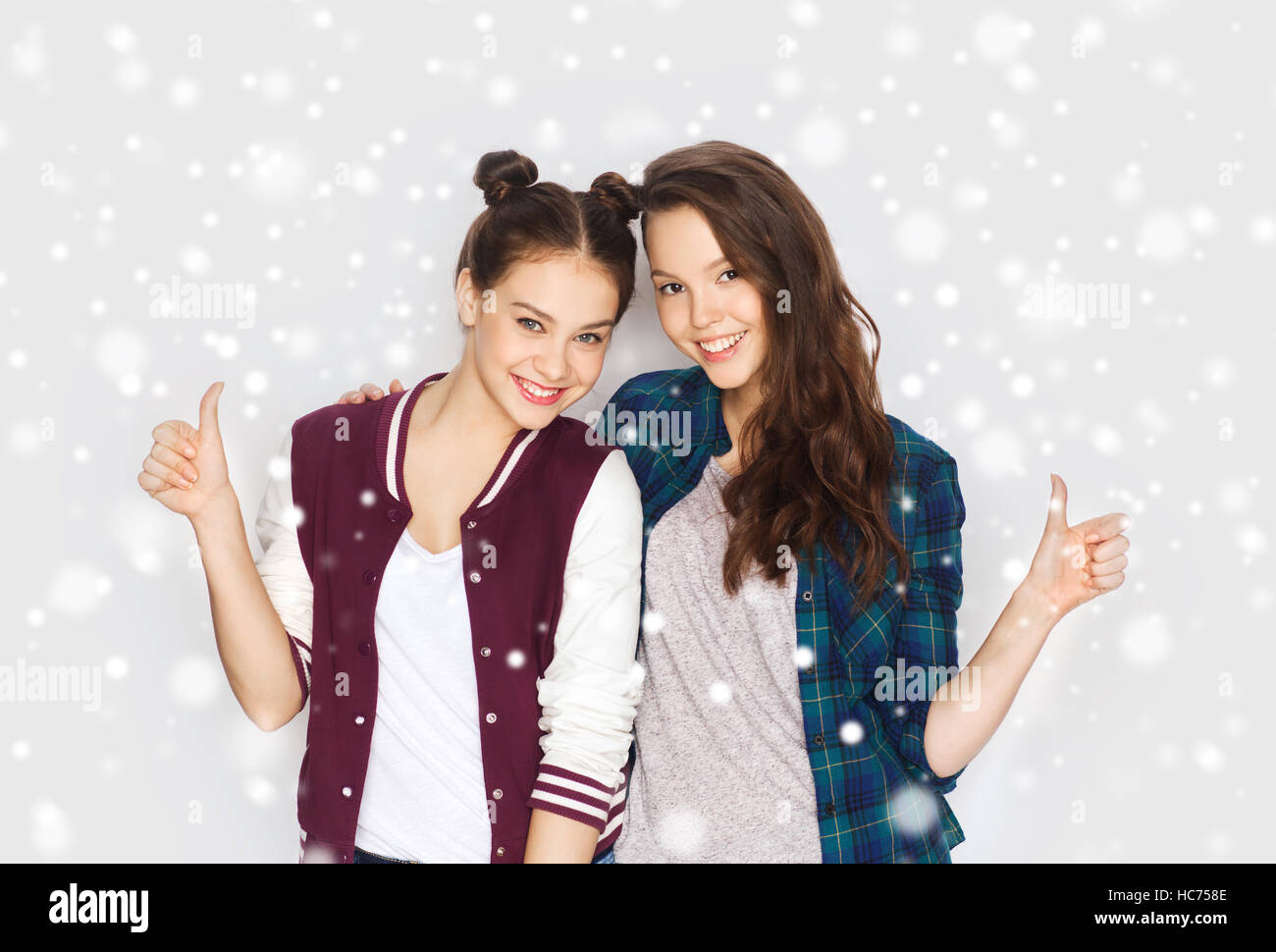 happy smiling teenage girls showing thumbs up Stock Photo - Alamy