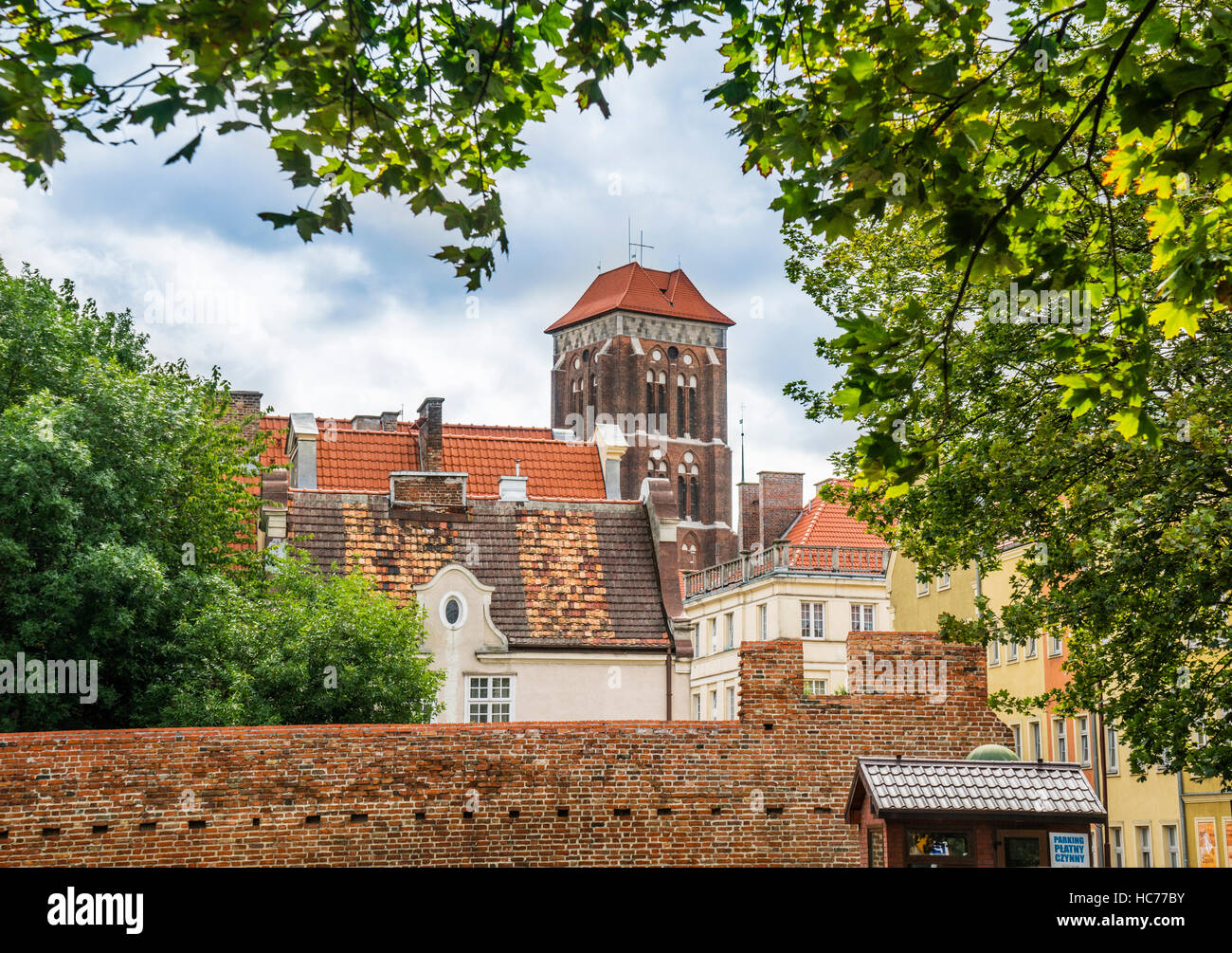 Poland, Pomerania, Gdansk (Danzig), remains of medieval city walls at the former Strawberry Market with view of St. Mary's Church Stock Photo