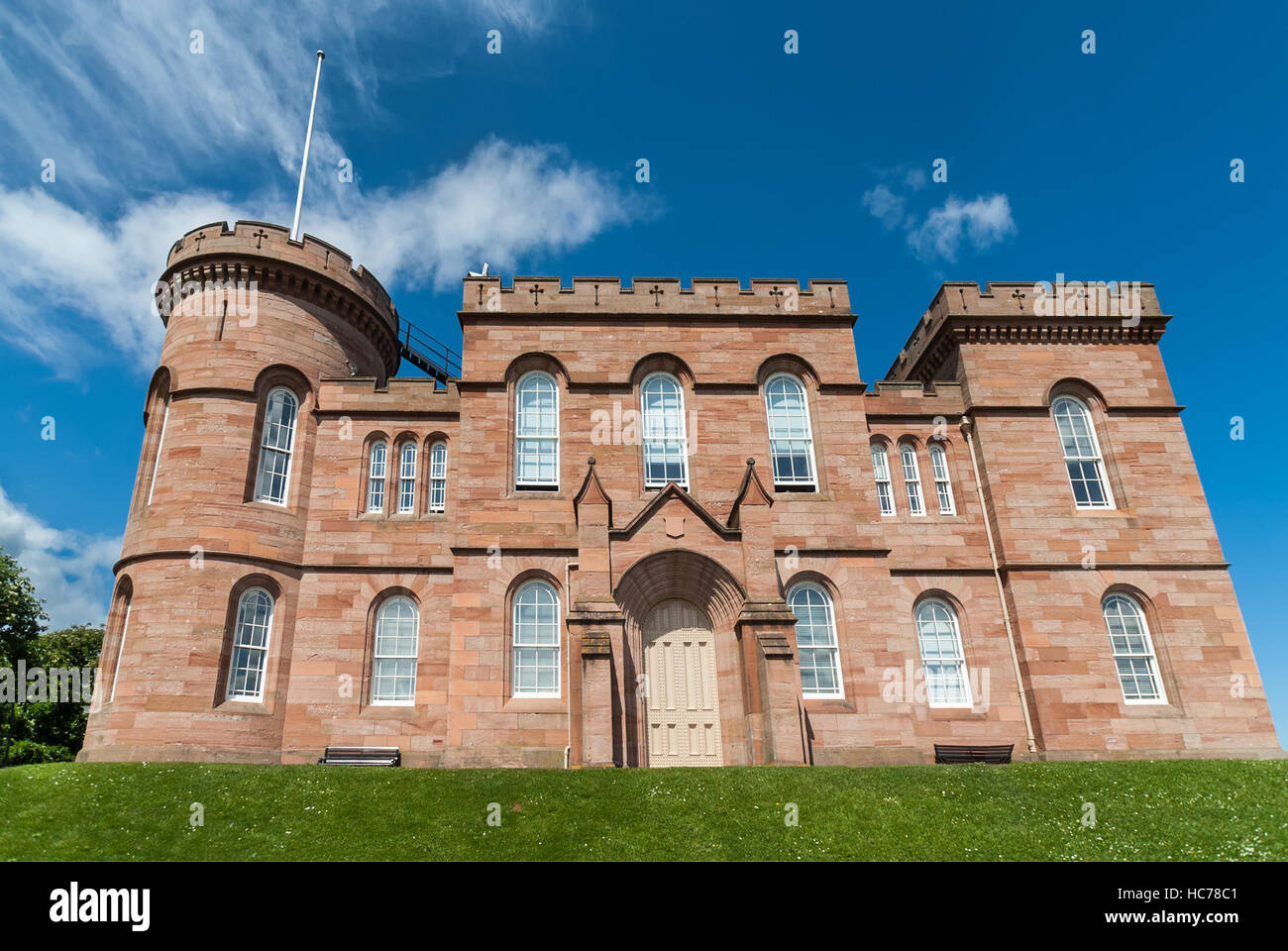 Inverness Castle on green hill. Stock Photo