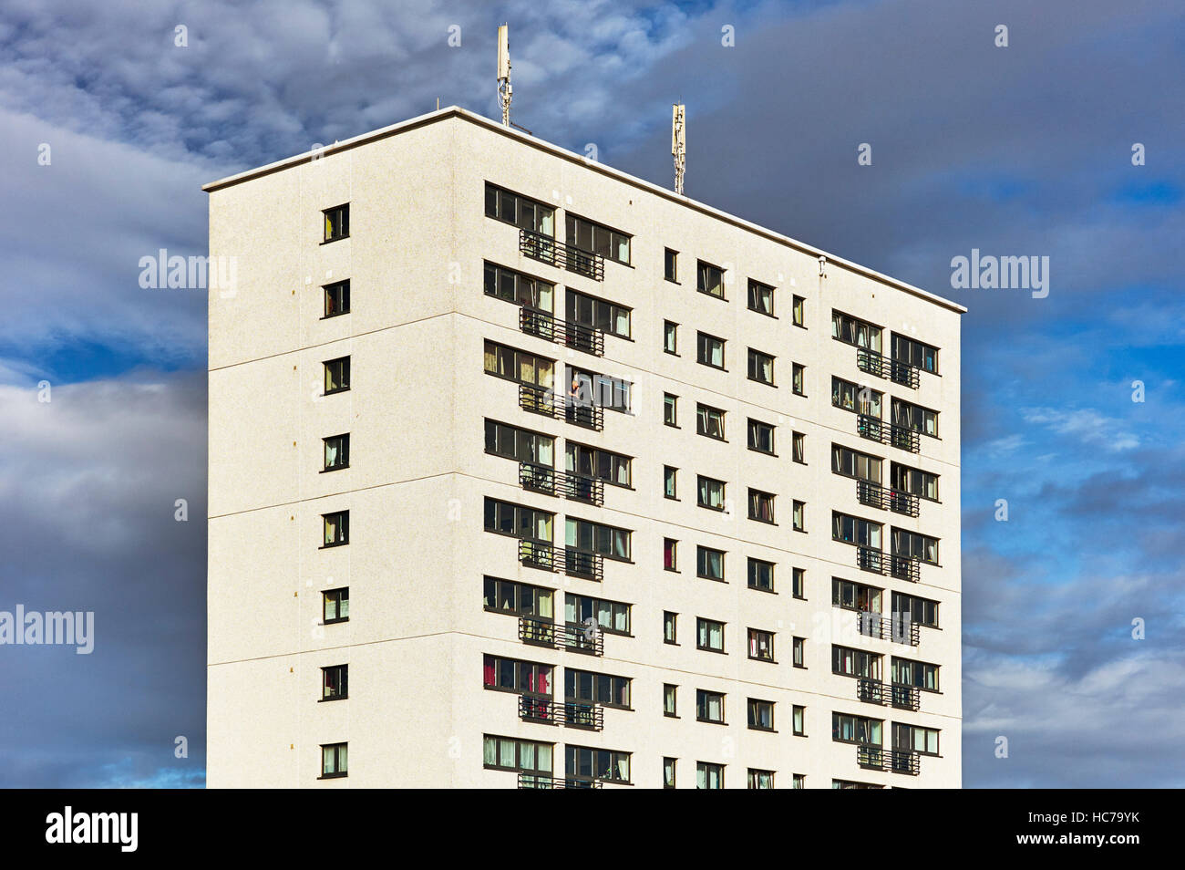 Block of flats in Bridlington with person looking out Stock Photo Alamy