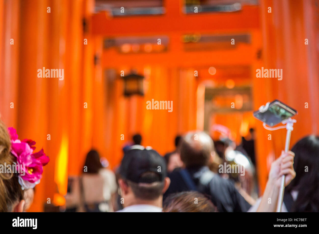 KYOTO, JAPAN - OCTOBER 8, 2016: Unidentified people at walkway in Fushimi Inari shrine in Kyoto, Japan. This popular shrine have 32,000 sub-shrines  t Stock Photo