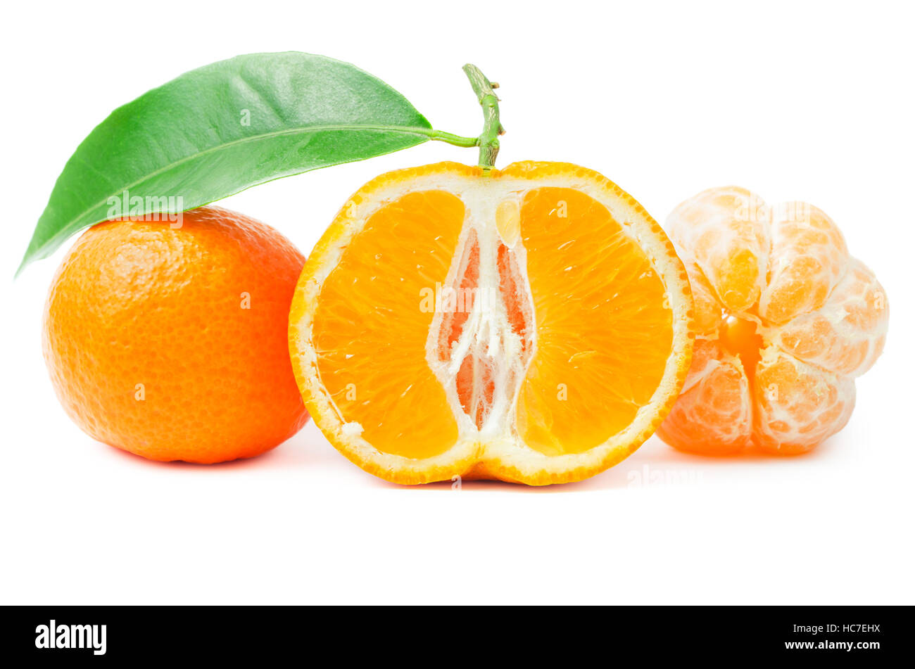 Citrus with leaf, cut in half mandarin, peeled tangerine isolated on a