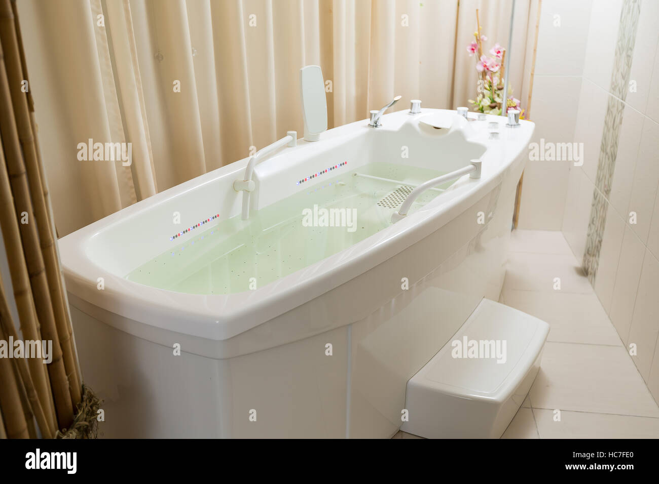 Empty jacuzzi, tub filled with water in the spa Stock Photo