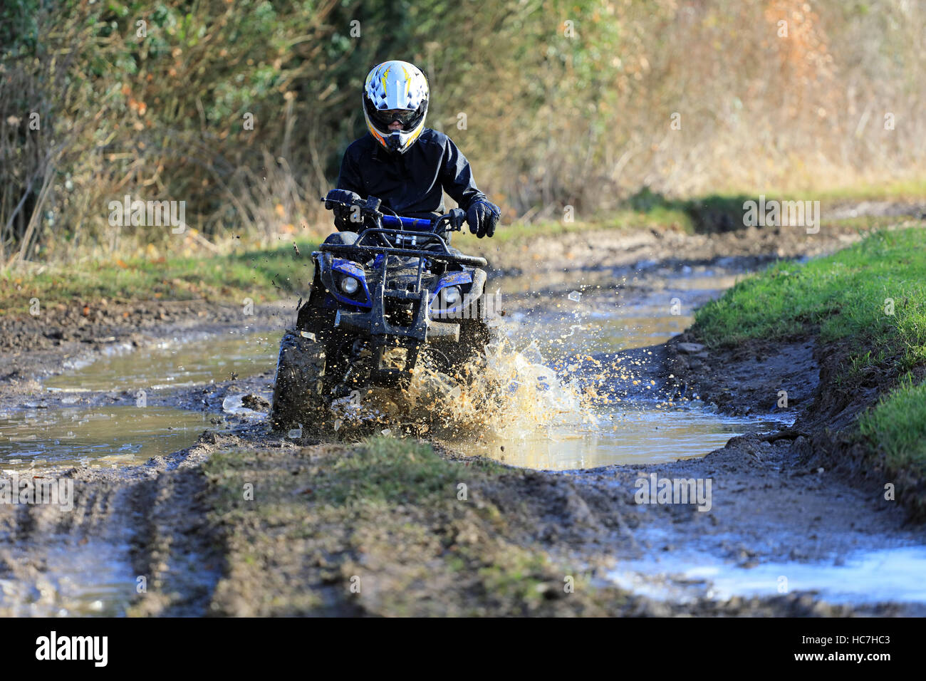 Quad biking on a dirty track, English farmland, UK Stock Photo - Alamy