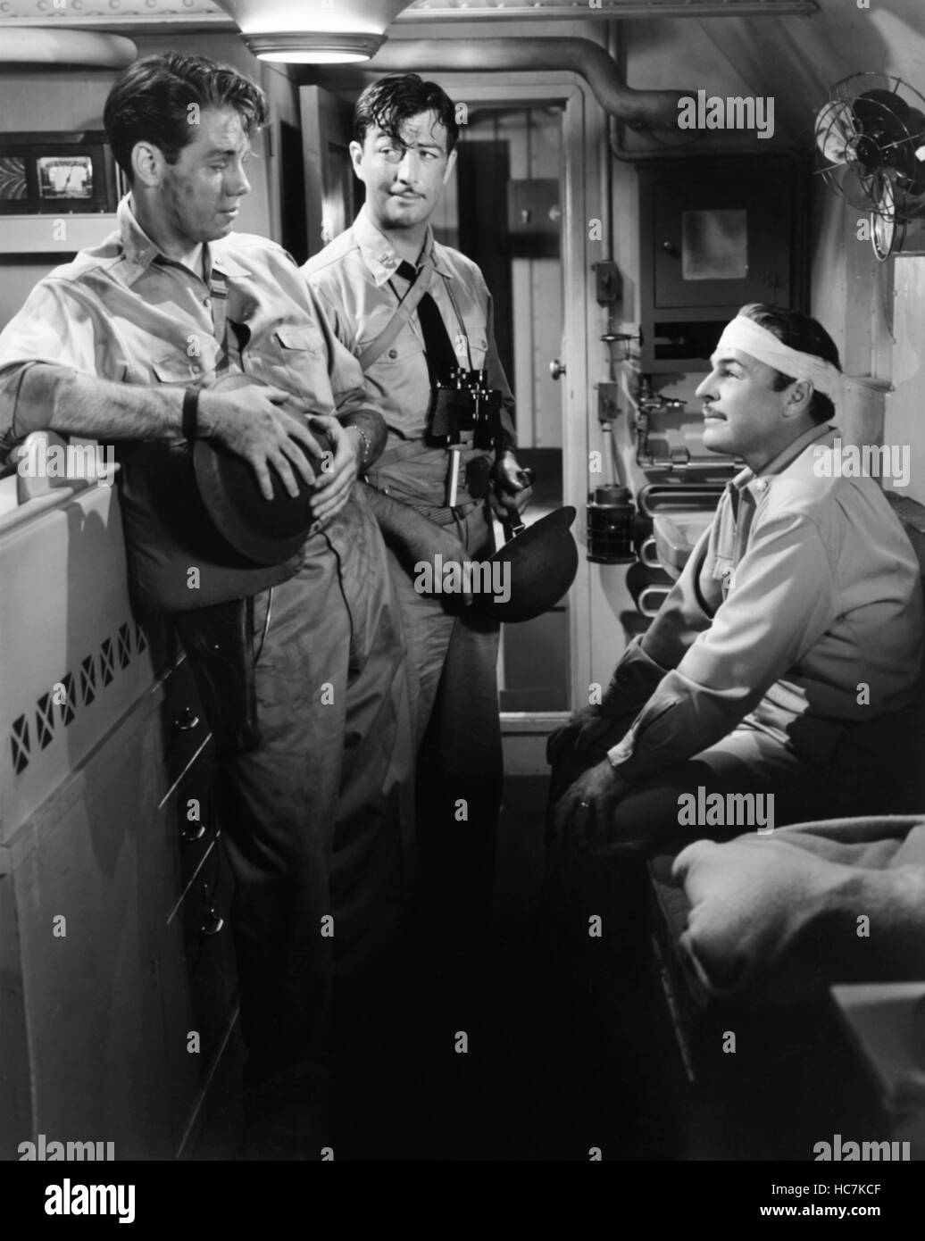 STAND BY FOR ACTION, from left, Richard Quine, Robert Taylor, Brian