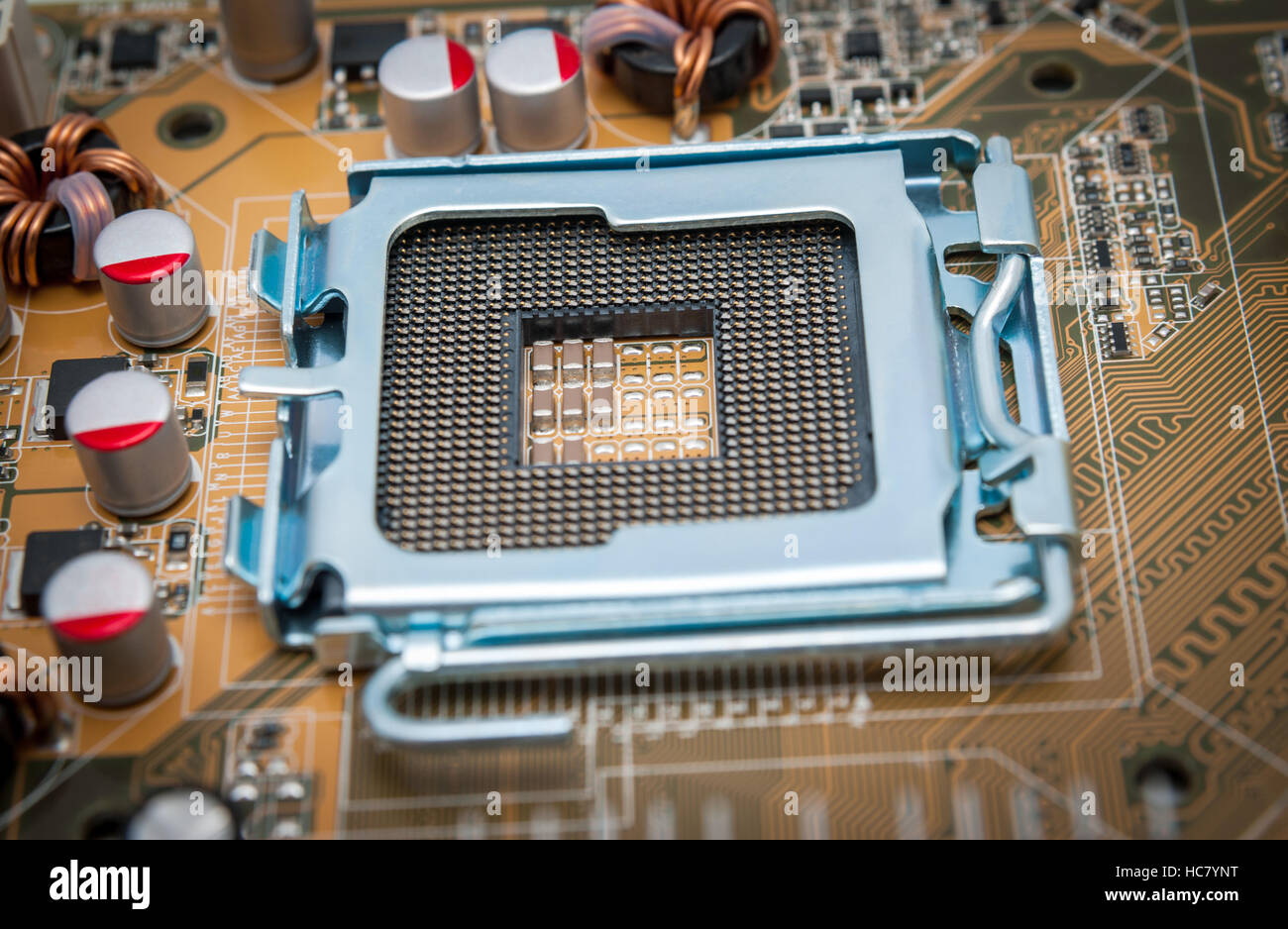 Empty CPU processor socket with pins on motherboard Stock Photo